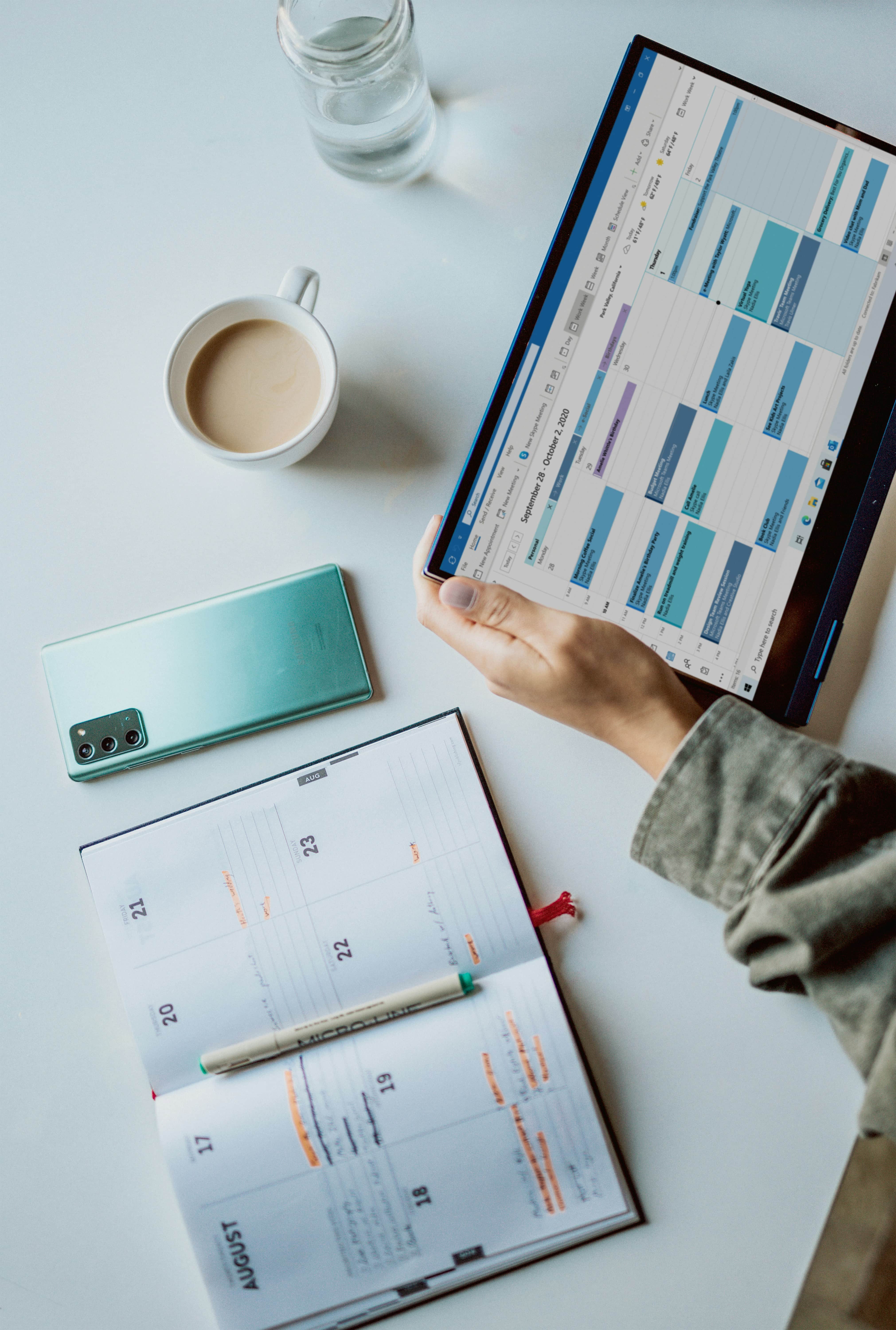 how_far_in_advance_to_plan_an_event calendar on a desk with a notebook and cup