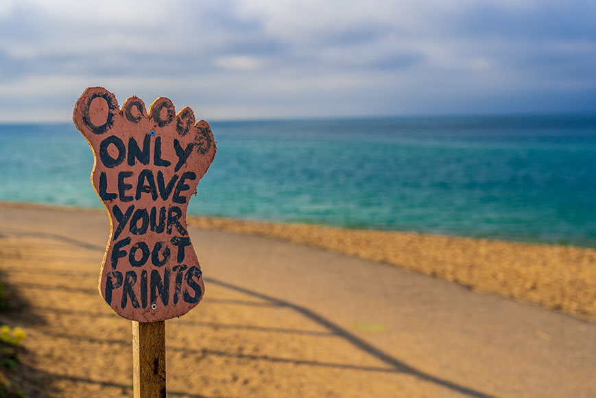 Only leave your foot prints sign on a beach